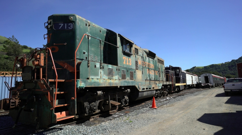 Ground-truth photo of locomotive 713, the held-out test view none of these models ever saw