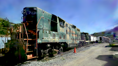 The same view after oversize-prune parity, 18.37 dB: the sky cleans up and the background solidifies